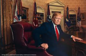 Image of usa president Donald Trump sitting on a chair in white house