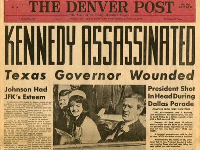 Images showing news headline that president kennedy was shot dead on his head while going to dollos